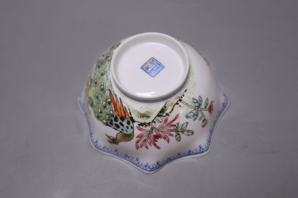 A pair of Chinese famille rose bowls and covers, late 19th century, a blue and white box and cover, 11cm and an eggshell bowl, 8cm